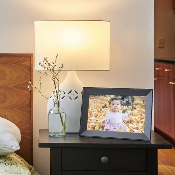 Charcoal Carver frame beside the bed